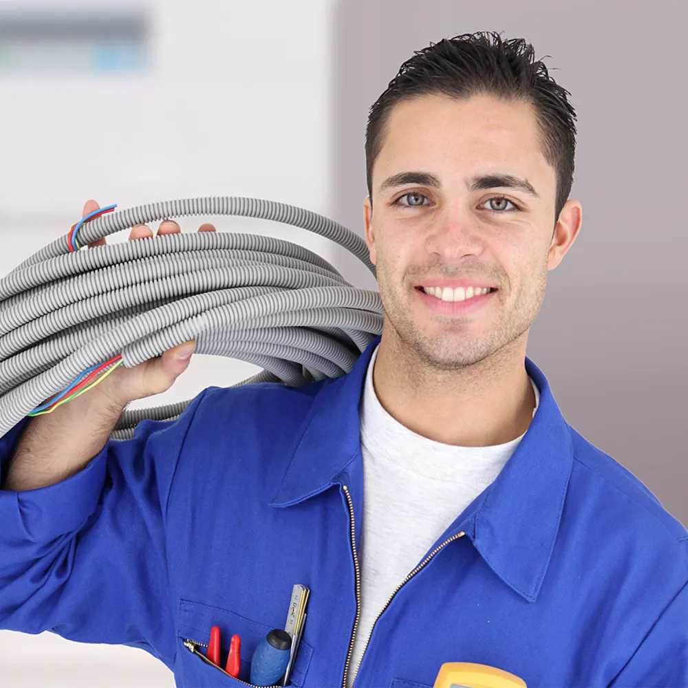 Electrical installer carrying a coil of cable